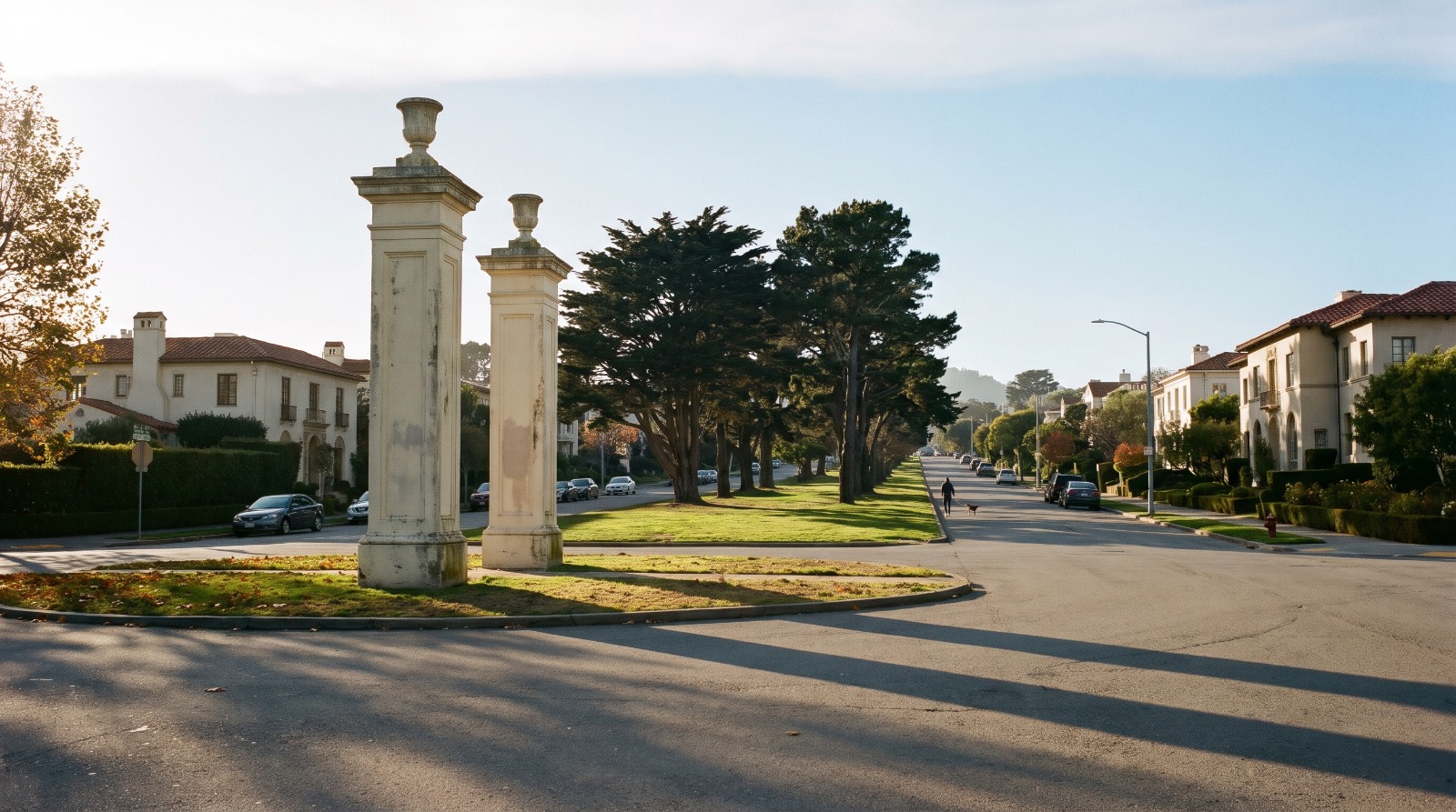 The St. Francis Wood entrance pillars at St. Francis Circle in San Francisco, looking up St. Francis Boulevard at golden hour